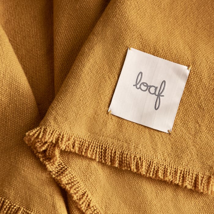 642940-nuzzler-throw-ochre-019-crop